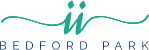 Bedford Park logo with a green wave design.